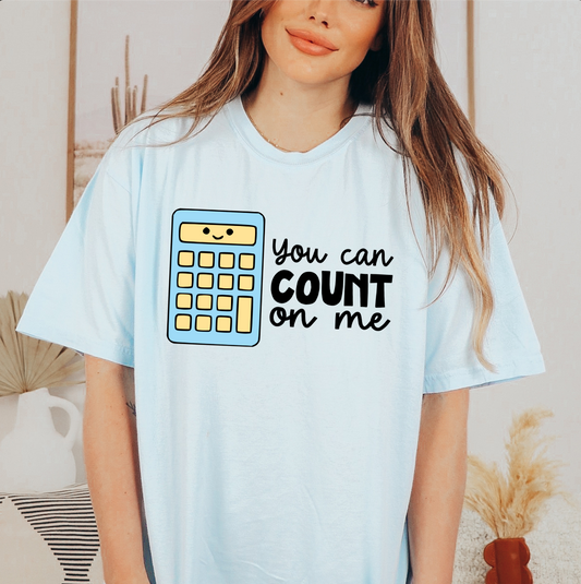 a woman wearing a t - shirt that says you can count on me