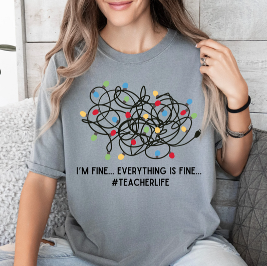 a woman wearing a t - shirt that says i'm fine, everything is