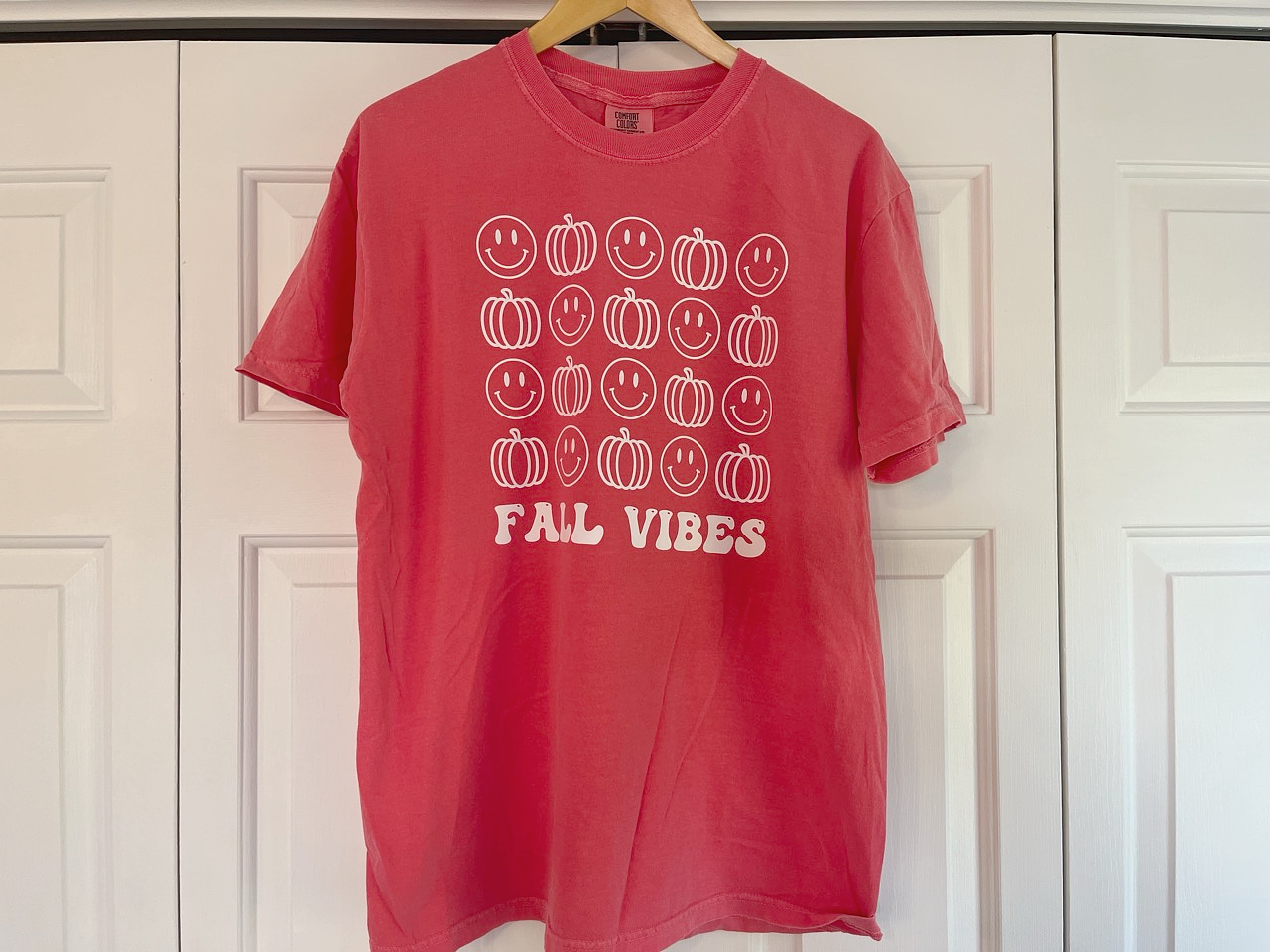 a red t - shirt that says fail vibes on it