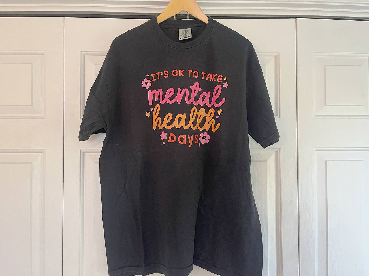 a black t - shirt that says it's ok to take mental health days