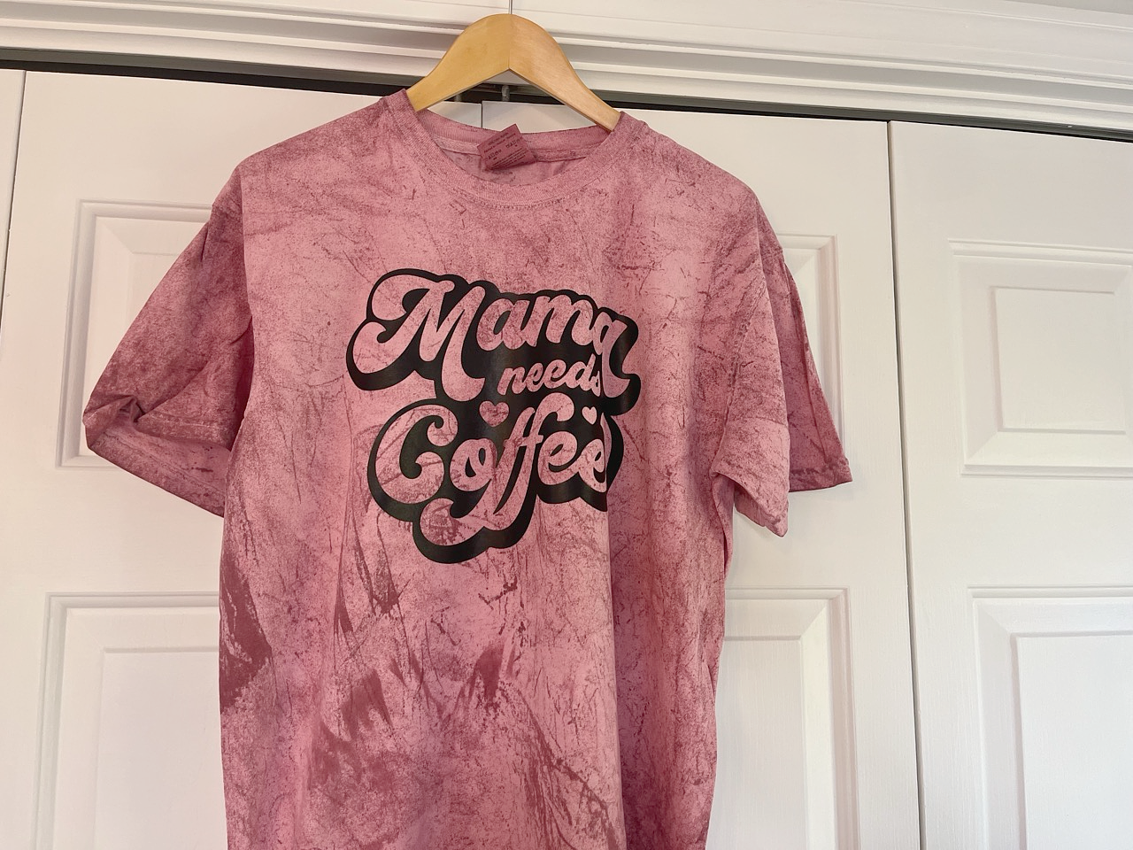 a t - shirt that says mama needs coffee on it