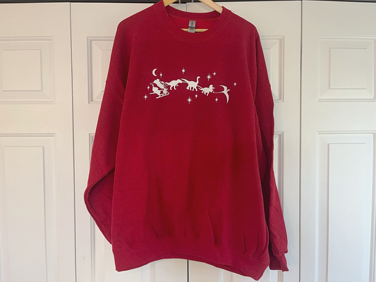 a red sweater with a white design on it