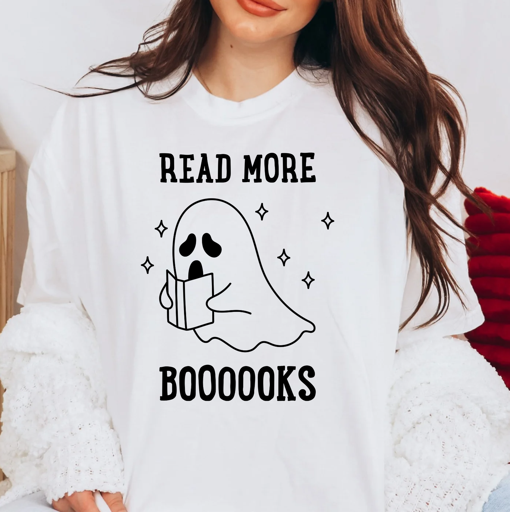 a woman wearing a t - shirt that reads read more books