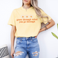 a woman wearing a yellow t - shirt that says grow through what you go through