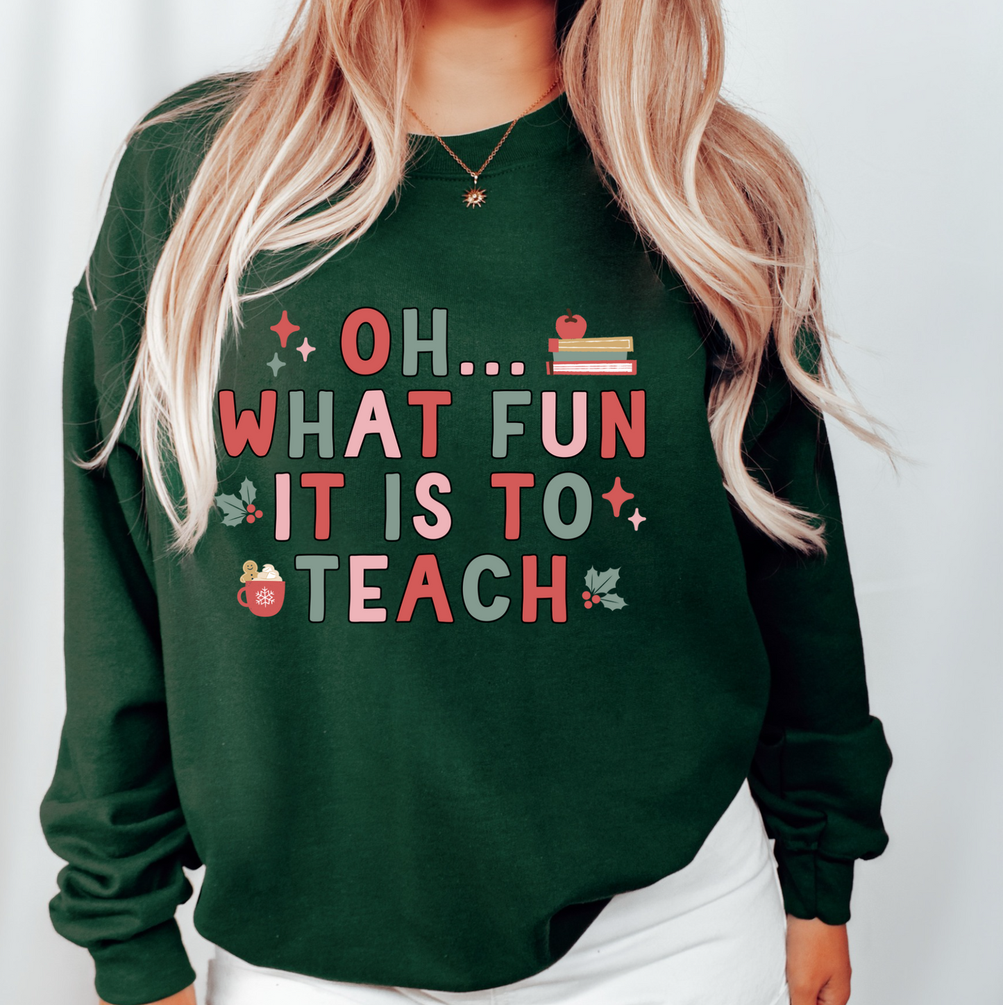 a woman wearing a green sweatshirt that says oh what fun it is to teach