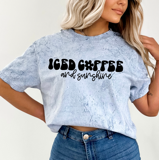 a woman wearing a crop top that says iced coffee and sunshine juice