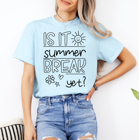 a woman wearing a blue shirt that says is it summer break yet?