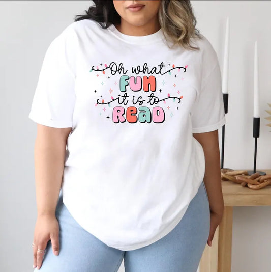 a woman wearing a white shirt that says oh what fun it is to read