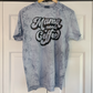 a t - shirt that says mama needs coffee hanging on a door