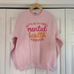 a pink sweatshirt that says it's ok to take mental health days