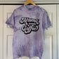 a purple shirt that says mama needs coffee on it