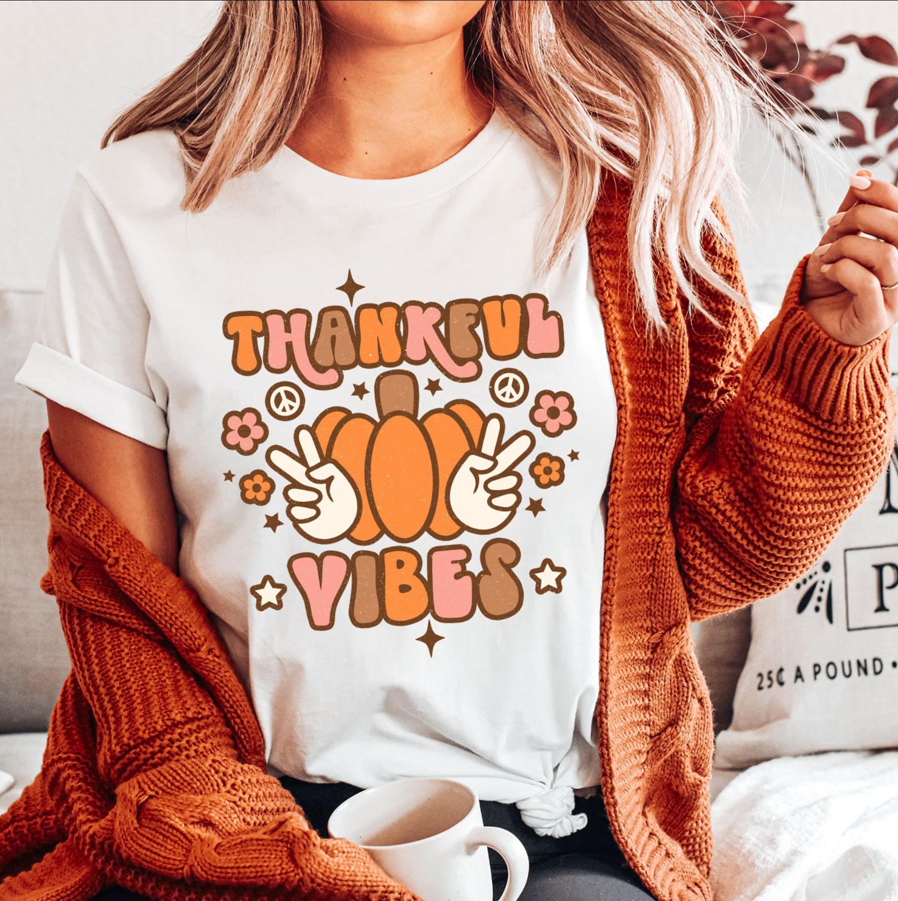 a woman wearing a thanksgiving vibes t - shirt