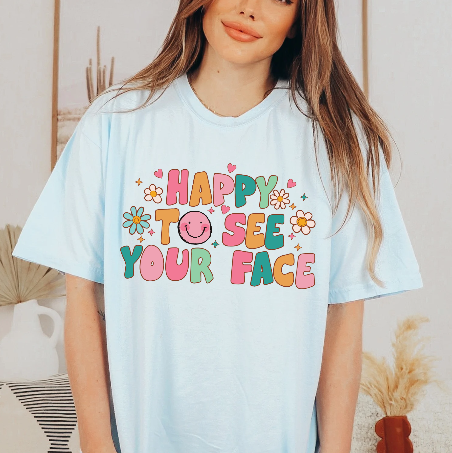 a woman wearing a happy to see your face t - shirt