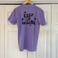 a purple shirt that says keep on selling on a hanger