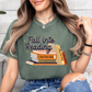 a woman wearing a fall into reading t - shirt