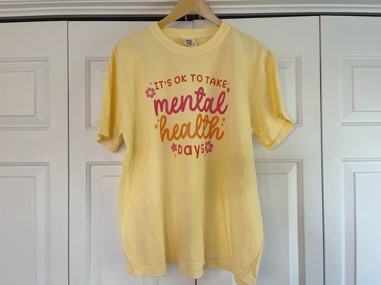 a yellow t - shirt that says it's ok to take mental health days