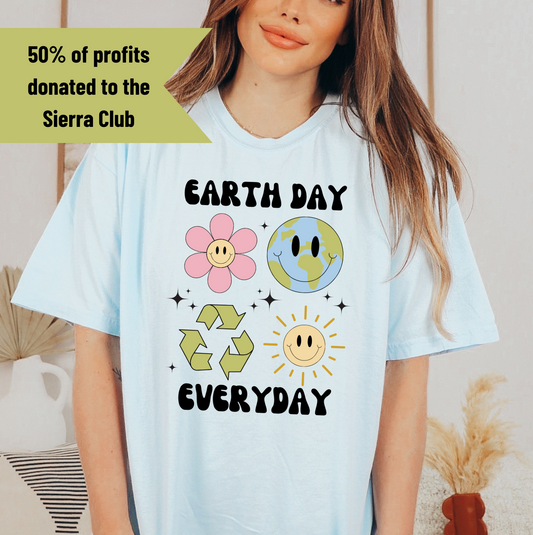 a woman wearing a t - shirt that says earth day everyday