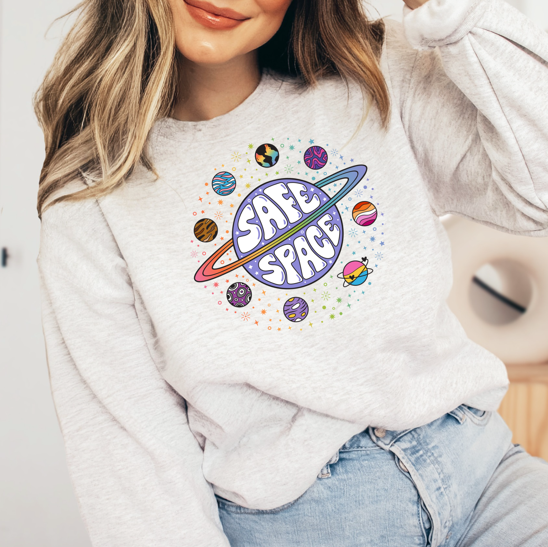 a woman wearing a sweatshirt that says safe space