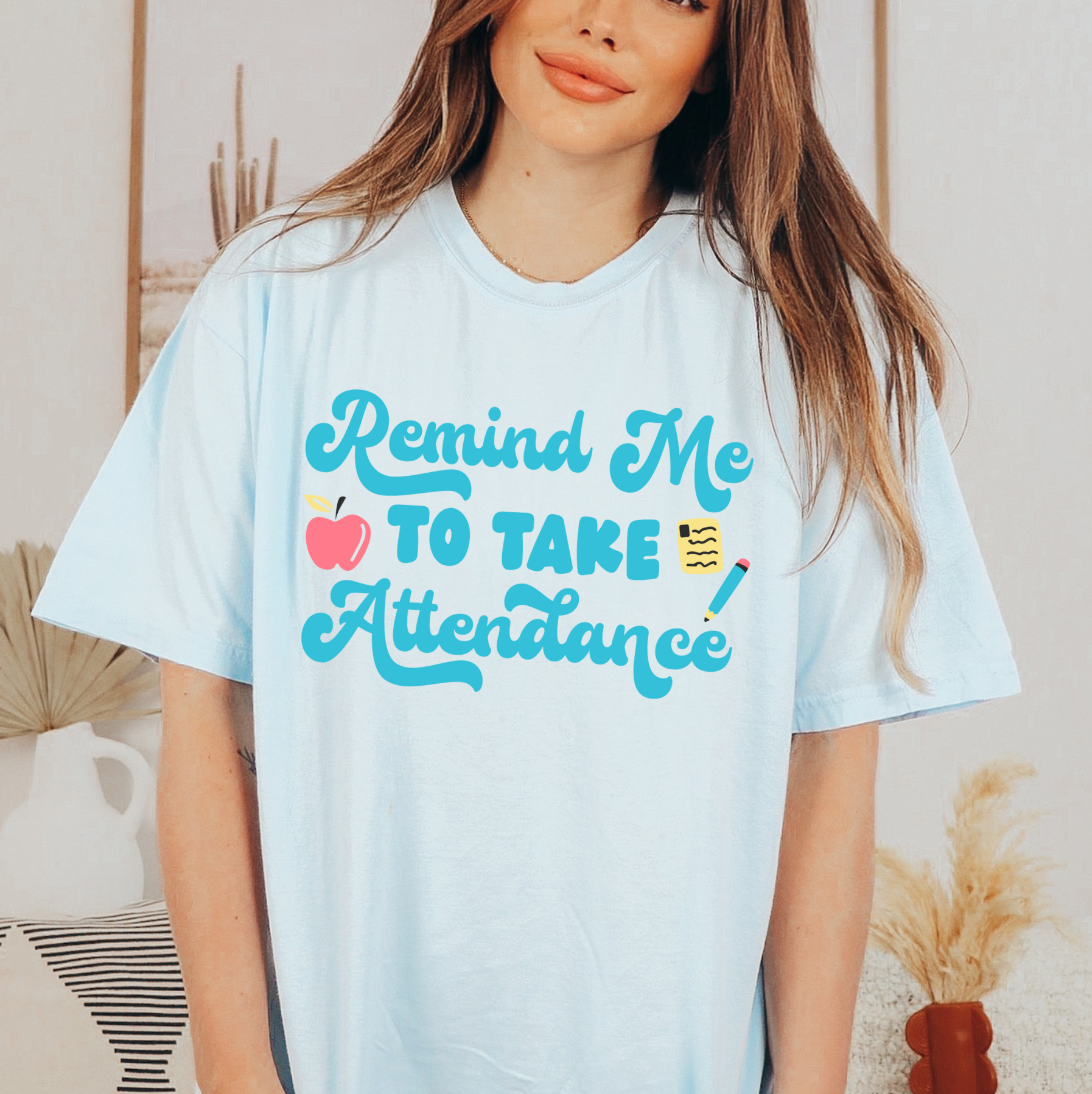 a woman wearing a t - shirt that says, remind me to take attendance
